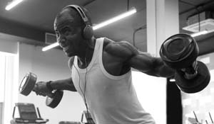 Men’s health after 50 and man training with dumbbells